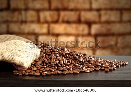 bricks wall and dark desk of coffee