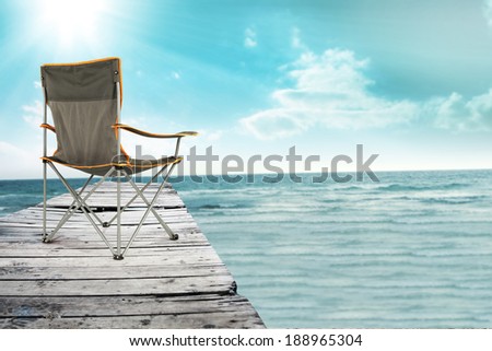 wooden pier chair sea and sun