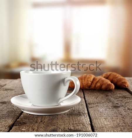 window and coffee with croissants