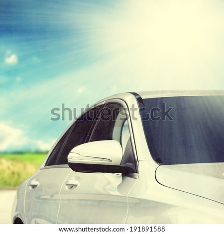 retro photo of silver car in sunlight