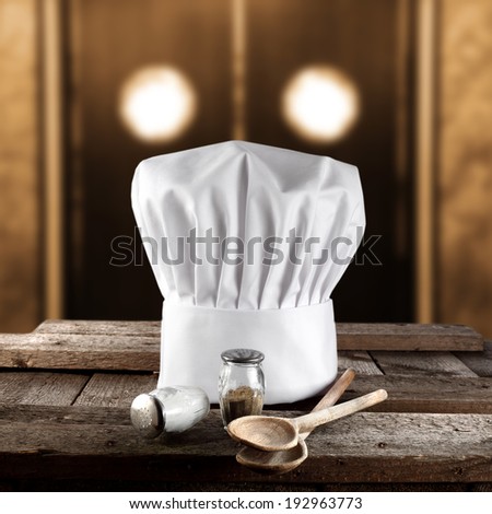 wooden spoon and cook hat