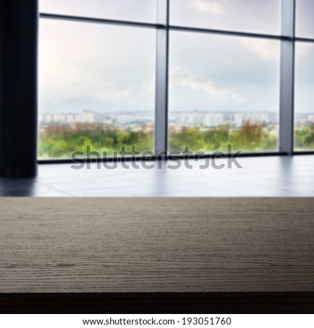 desk of dark color and window