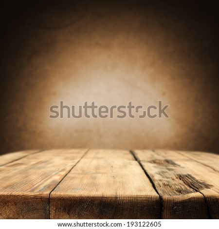 old worn table and wall of brown with free space for text