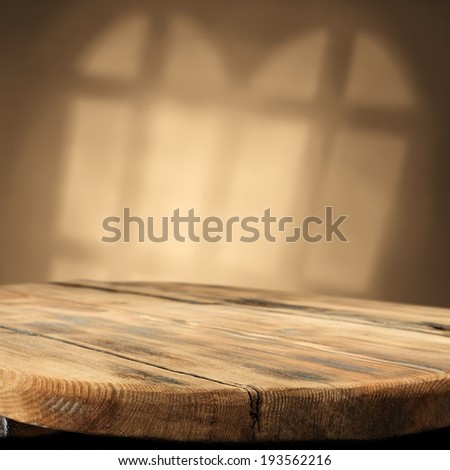 worn table worn wall and window shadow