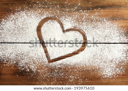 white fresh flour and board of love