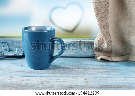 heart on glass and blue mug