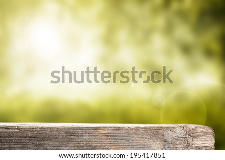 fresh green garden space and space for you on wooden desk