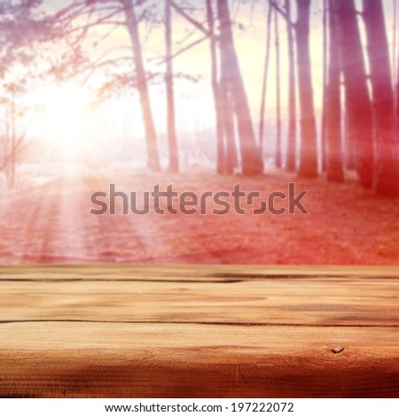 empty desk and forest with sunset