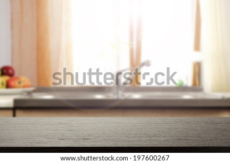 dark desk of top and kitchen window