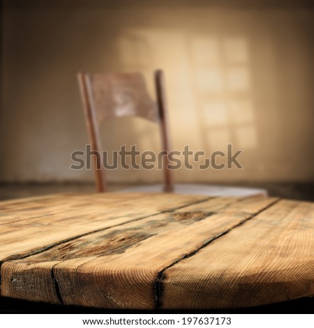 desk of wood and chair with shadow of morning window
