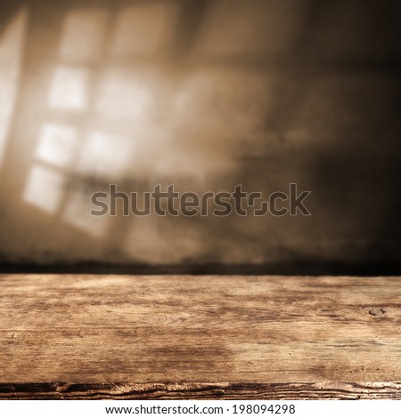 desk of wood and shadow of window in brown interior space