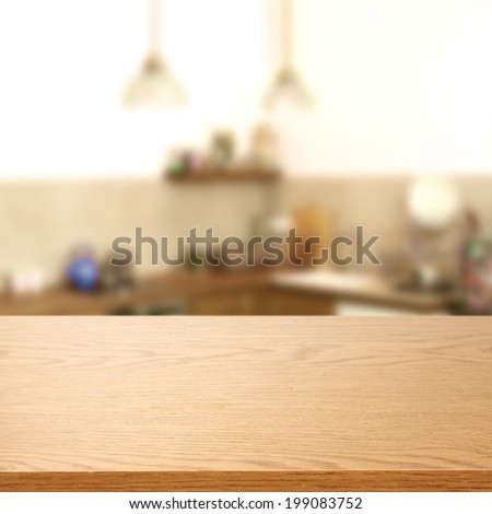 desk of wood of yellow color and kitchen background