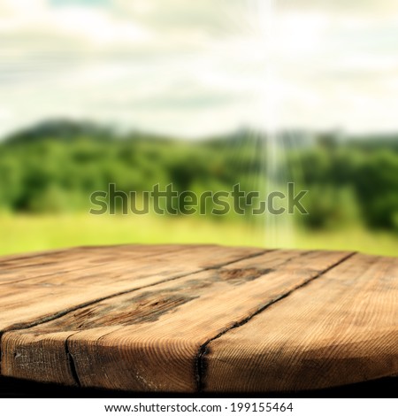 table and forest with sky and sun