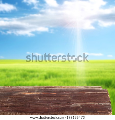 color of sun on the sky and desk of wood
