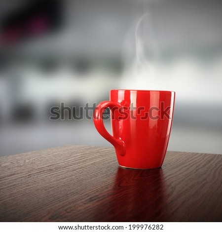 dark desk and red mug