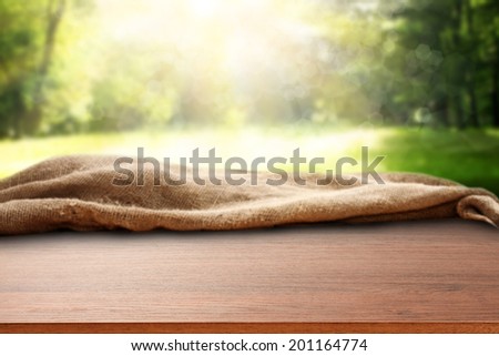 garden background with sun light and brown desk of free