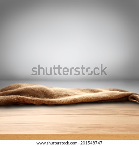free space of wooden top and gray wall with shadows