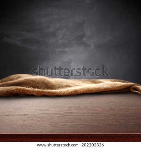 dark brown desk and blackboard