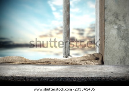 sill of gray wood and window space
