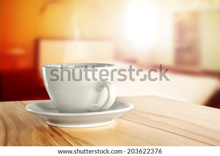 desk of furniture with coffee cup and window of sun light
