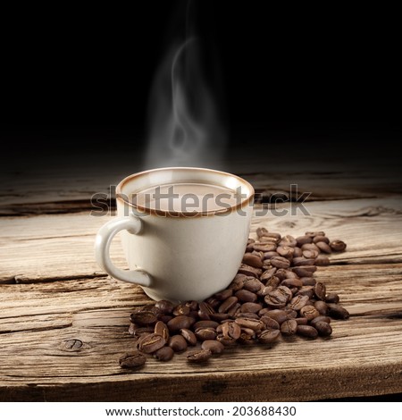 coffee grains and coffee cup with smoke