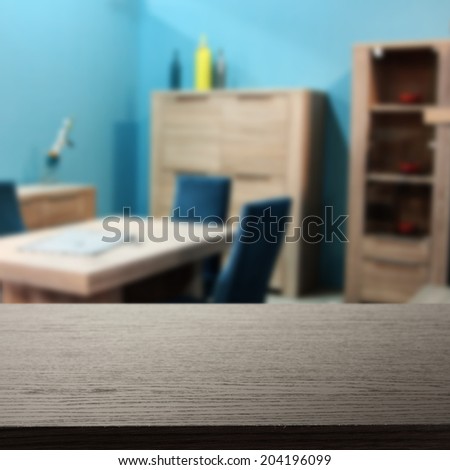 dark desk and blue wall