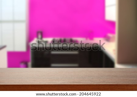 brown desk and kitchen of pink color