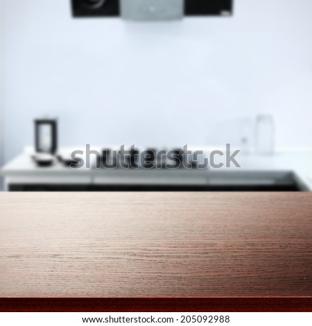 dark desk and blue kitchen