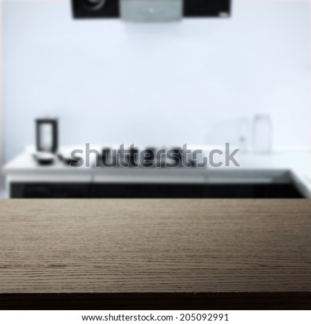 dark black desk and blue kitchen space