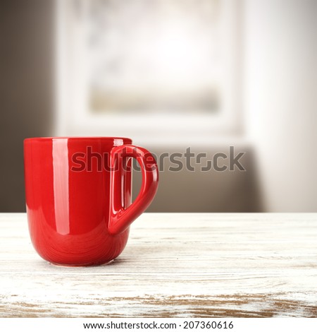 red mug on white desk