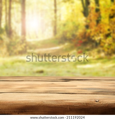 autumn forest desk of wood and sunset