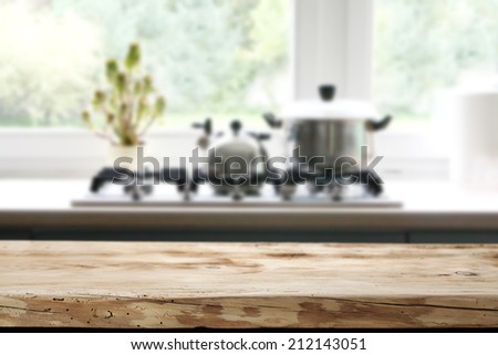 worn old desk with kitchen with window