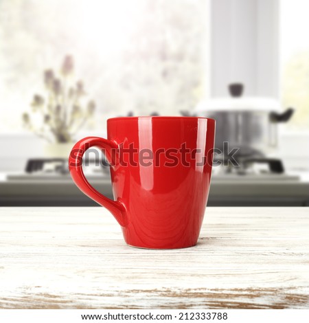 white desk and red mug in kitchen