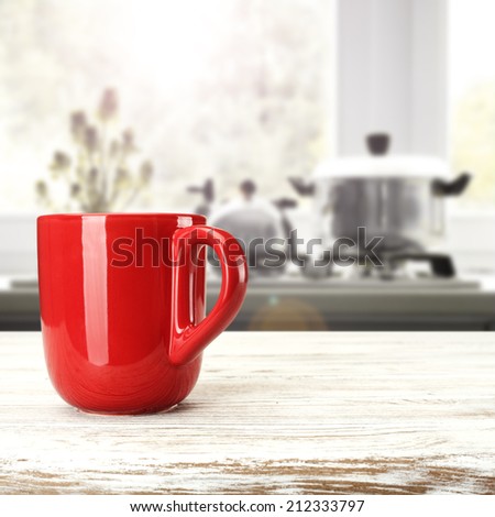 red mug and white desk