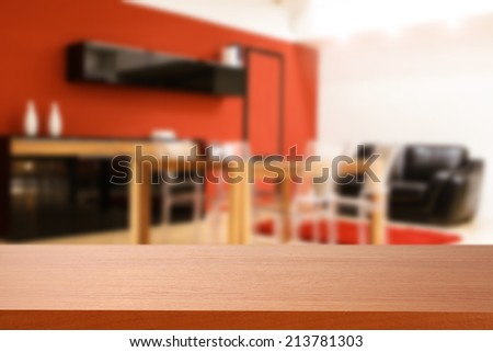 red desk of wood and red wall in room