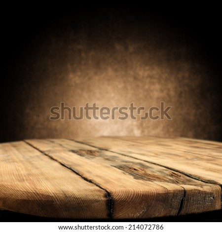 worn table and brown wallpaper