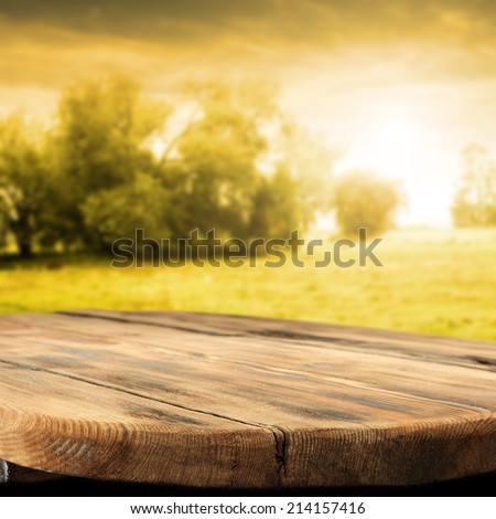 empty desk of wood with sunny background