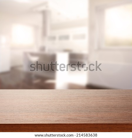 dark brown desk top of free space and interior of kitchen