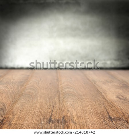 gray wall and brown wooden floor space