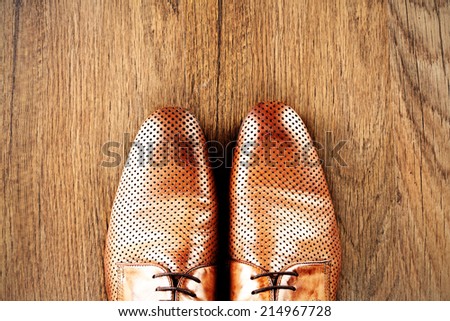 brown shoes on brown floor