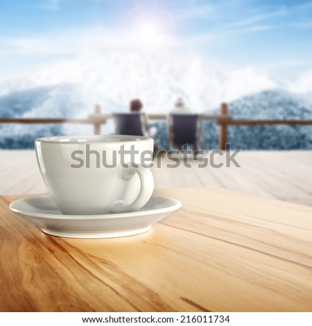 cup of coffee and yellow desk