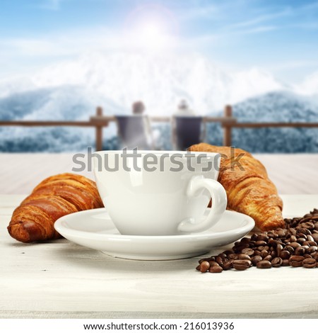 coffee cake and landscape of winter mountain