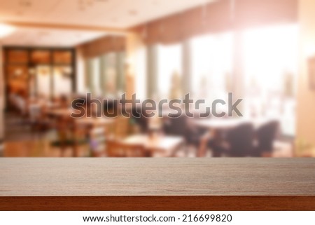 restaurant interior and dark desk of wood