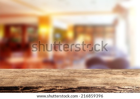 dark brown desk of wood and interior of restaurant
