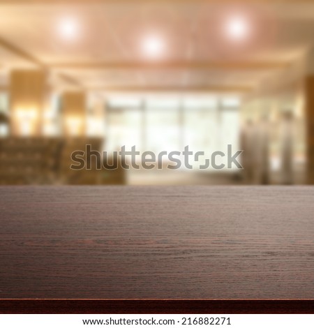 dark desk of wood and blurred space