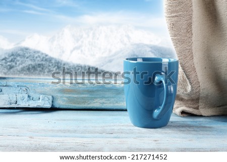 winter window with blue mug