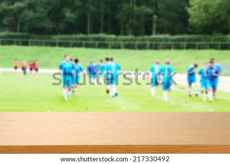 men in blue and desk of sport