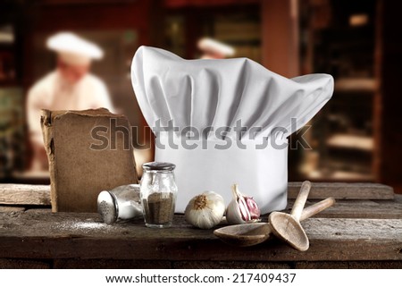 white cook hat and retro cook book