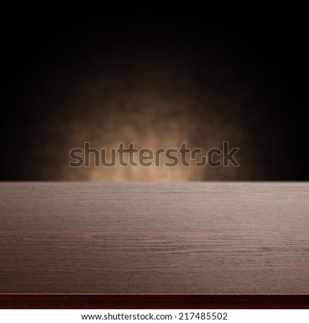 dark desk with shadow and wall of brown