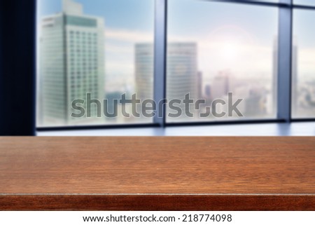 brown desk of free space for you with window view and landscape of city